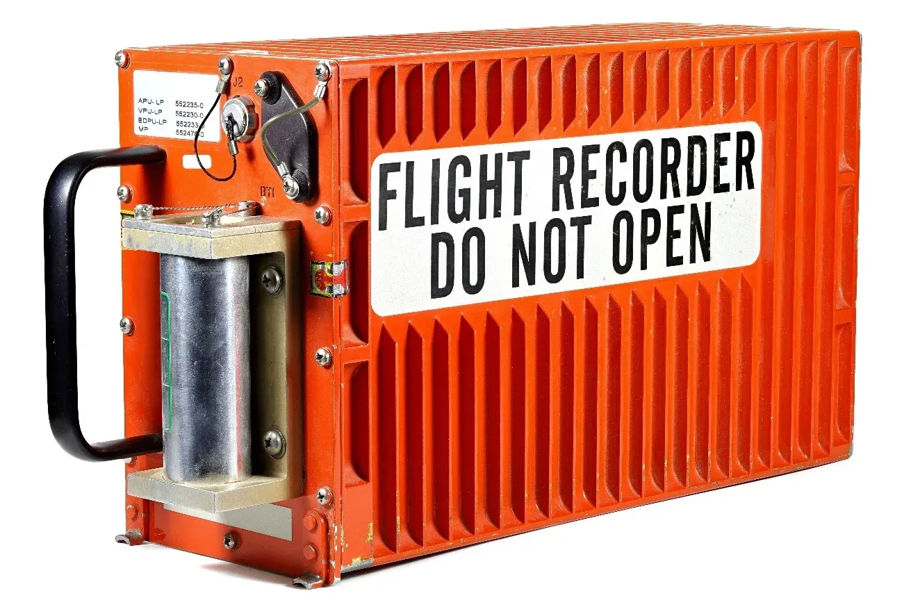 An orange flight recorder marked Flight Recorder Do Not Open.